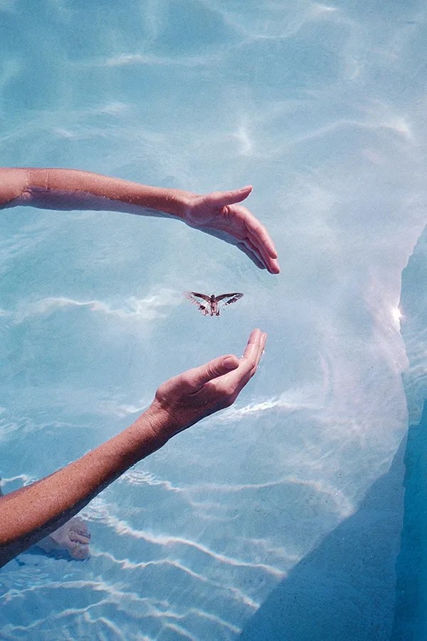 photo of hands in water
